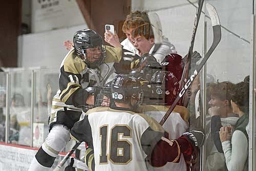 In this Feb. 19, 2026 file photo, Colton Berray (11) joins the celebration with teammates after the game-winning goal in the second overtime of Lakeland’s 3-2 win over Shawano/Bonduel in a WIAA Division 2 regional final game at the Lakeland Hawks Ice Arena in Minocqua. (Photo by Brett LaBore/Lakeland Times)