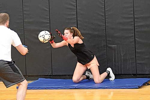 Ava Evenhouse practices her goalie skills during the first day of the season Monday, March 23 at Lakeland Union High School in Minocqua. Evenhouse is a returning first team all-conference keeper. (Photo by Brett LaBore/Lakeland Times)