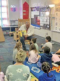 LdF Tribal Judge Gary Smith reads to students during the Read Across America event on Thursday, March 5 at Lac du Flambeau Public School. (Contributed photograph)