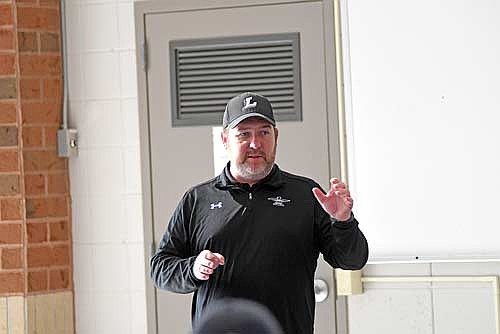 Coach Scott Howard talks to the golf team during the first day of the season Monday, March 30 at Lakeland Union High School in Minocqua. (Photo by Brett LaBore/Lakeland Times)
