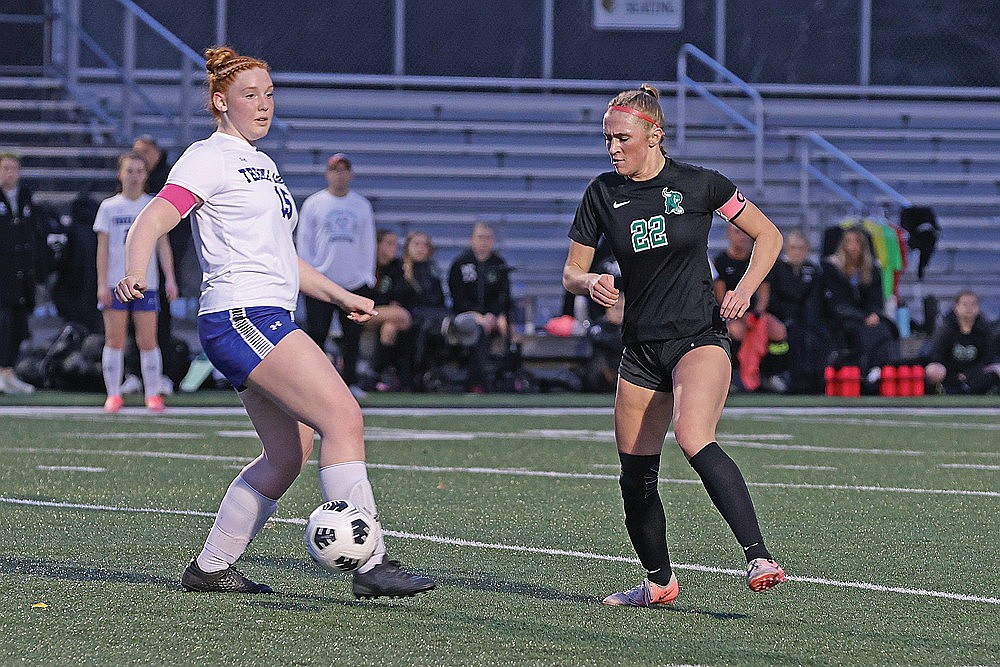 Rhinelander’s Vivian Lamers dribbles past a Three Lakes defender during a girls’ soccer scrimmage at Mike Webster Stadium Monday, March 30. Lamers, a junior, is the reigning GNC co-offensive player of the year. She led the Hodags in scoring last year with 26 goals and 57 total points. (Bob Mainhardt for the River News)