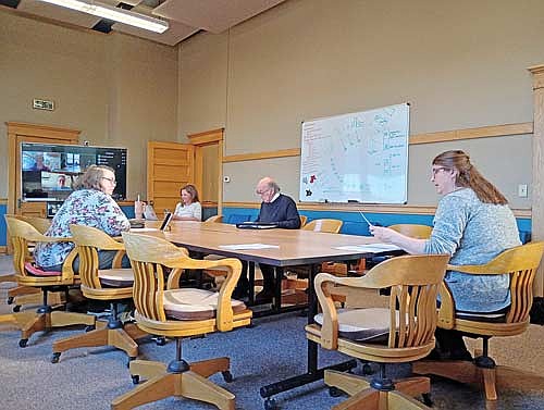 Meeting March 25 at Rhinelander City Hall to discuss the how and where of a new Hodag statue in the works were, from left, Carrie Mikalauski, Ashley McLaughlin, Jim Rosenburg and Virginia Roberts, and online, Marilyn Larsen, artist Don Gaber and (not shown) Tom Barnett. (Photo by Ardith Carlton/River News)