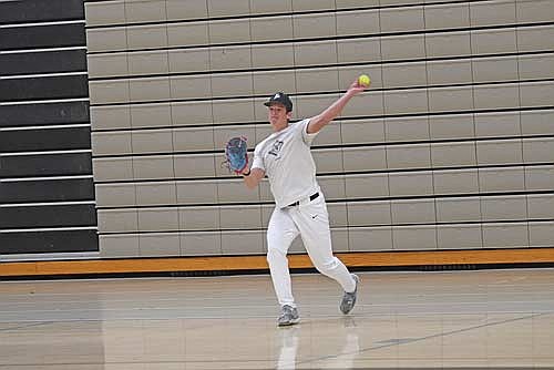 Drew Warren plays catch during the first day of the season Monday, March 23 at the Lakeland Union High School fieldhouse in Minocqua. Warren is Lakeland’s only returning all-conference player. (Photo by Brett LaBore/Lakeland Times)