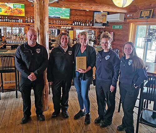 Deyna Schmitt was presented with a Lifesaver Award by the NEMSD on Saturday, March 28, in Manitowish Waters. Present for the award presentation, from left, are chief Jason Joling, deputy chief Jessie Mabie, Schmitt, paramedic Katie Czys and advanced emergency medical technician Rennea Remme. (Contributed photograph)