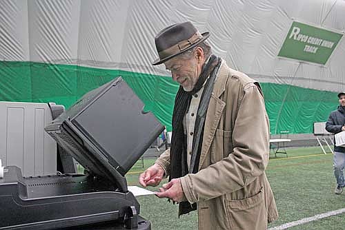 Feeding his ballot into a tabulator machine at the Hodag Dome, Steve Moe was one of more than 1,600 Rhinelander voters in Tuesday’s Spring Election. (Photo by Ardith Carlton/River News)