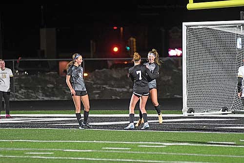 Malin Awker, right, and Lexi Gindorff celebrate after Awker’s first-career high school goal in the second half of the season opener against Hayward Tuesday, April 7 at IncredibleBank Field in Minocqua. Gindorff was awarded the assist. (Photo by Brett LaBore/Lakeland Times)
