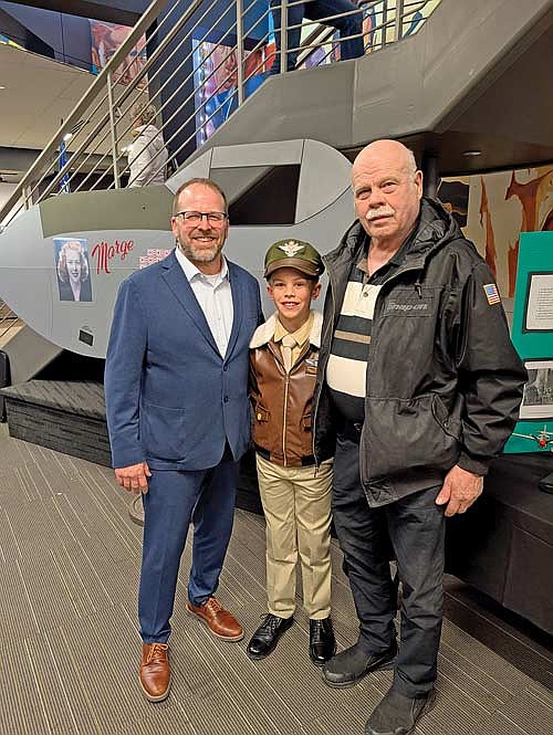 Nico Tippett with John Gidley, left, executive director of the Richard I. Bong Veterans Historical Center in Superior and one of Richard Bong’s nephews, Keith Fechtelkotter. (Contributed photograph)