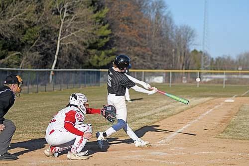 Jack Stella flies out in the fifth inning of a conference game against Medford Friday, April 10 at Raider Field in Medford. (Photo by Brett LaBore/Lakeland Times)