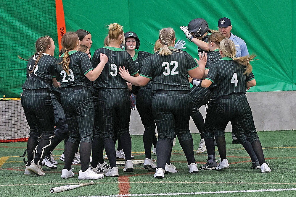 Teammates surround Rhinelander’s Ava Rathbun at home plate after Rathbun hit a walkoff home run in the seventh inning of a GNC softball game against Antigo in the Hodag Dome Thursday, April 9. The Hodags scored five times in the seventh, capped by Rathbun’s two-run blast, to defeat Antigo, 9-7. (Bob Mainhardt for the River News)