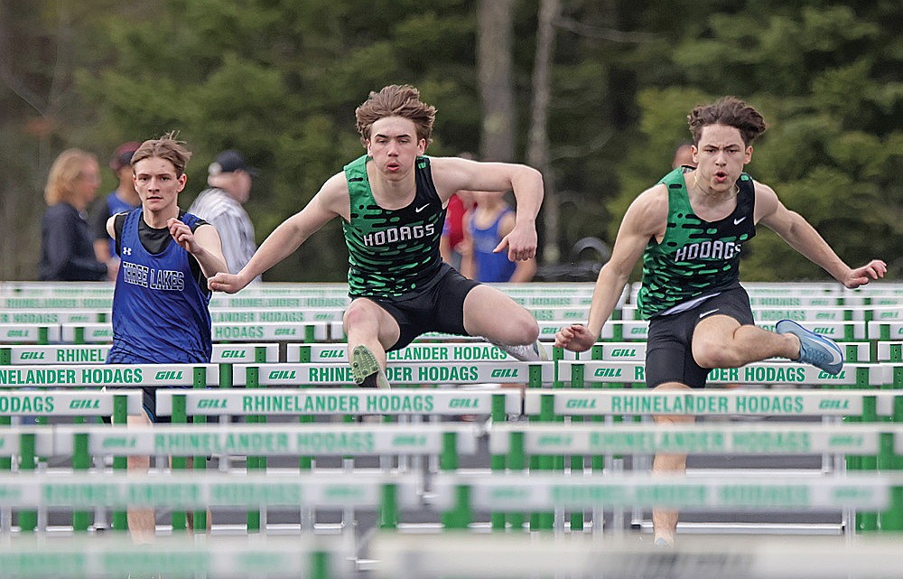Rhinelander’s Ryley Hull, center, and Amos Bergman, right, compete in the 110-meter hurdles during the Hodag Hybrid track meet at Mike Webster Stadium Tuesday, April 14. Bergman and Hull went 1-2 in the event as the Hodags won the team title. (Jeremy Mayo/River News)