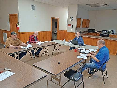Reporting to the electorate about 2025 in Pelican’s annual meeting April 14 were, from left, town supervisors James Cates and Walter Dahlquist Jr., board chairman Nick Scholtes, and clerk Mike Ring. (Photo by Ardith Carlton/River News)