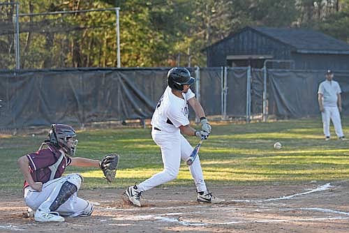 Max Keuer puts the ball in play and scores a run in the second inning of the home opener against Antigo Thursday, April 16 at the Lakeland Union High School baseball field in Minocqua. (Photo by Brett LaBore/Lakeland Times)