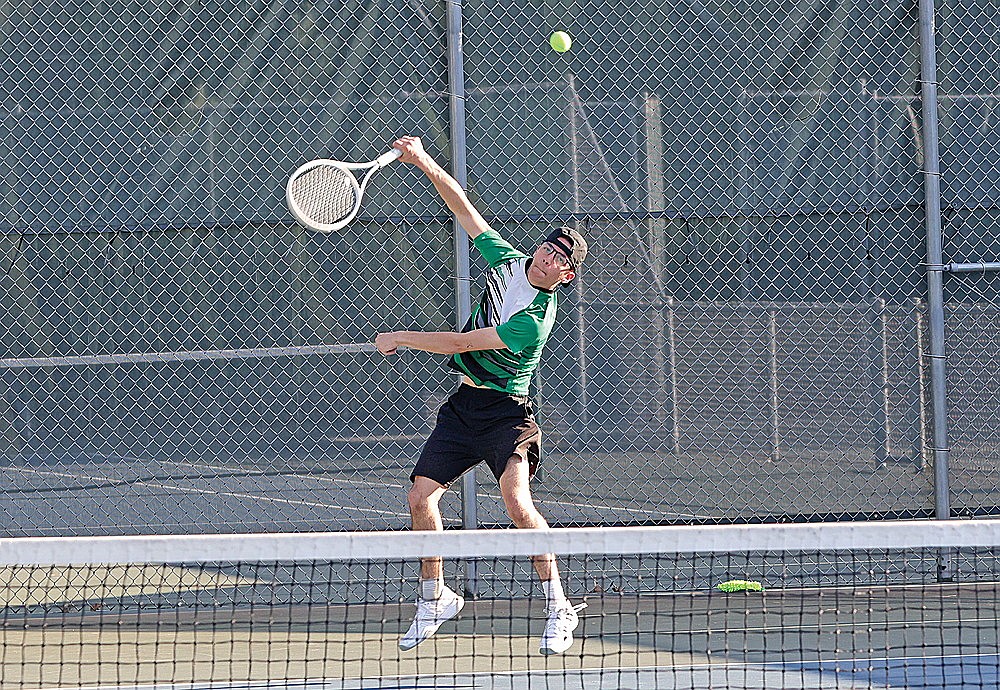 Rhinelander’s Asher Rivord serves during a GNC boys’ tennis match against Ashland at the RHS tennis courts Tuesday, April 21. Rivord won a match tiebreaker at No. 1 singles, helping the Hodags to a 7-0 victory. (Bob Mainhardt for the River News)