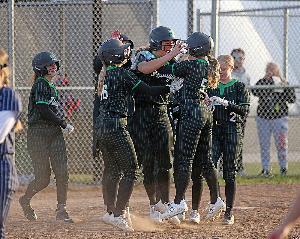 Members of the Rhinelander High School softball team celebrate after defeating Tomahawk in extra innings, 5-4, in a GNC softball game at the Haug Family Softball Complex Monday, April 20. (Blake Richard/River News)
