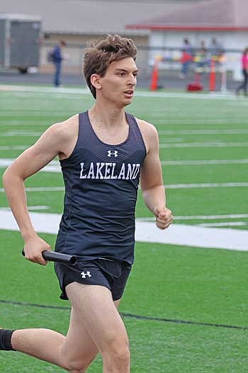Cam Schmidt runs his leg of the 3,200-meter relay during the Medford Invite Thursday, April 23 at Raider Field in Medford. Schmidt and the Thunderbirds won with a time of 9 minutes, 24 seconds. (Photo by Matt Frey/Star News)