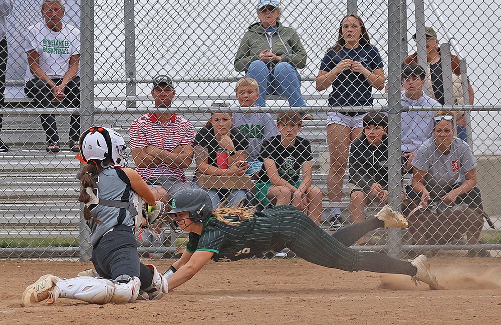 Rhinelander’s Ava Rathbun attempts to beat a tag by Lakeland catcher Lani Frisch during the sixth inning of a GNC softball game at the Haug Family Softball Complex Thursday, April 23. Rathbun was called out on the play and Lakeland defeated Rhinelander, 10-5. (Bob Mainhardt for the River News)
