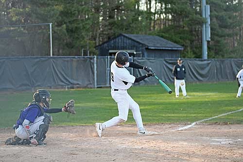 Gabe Karch drives a two-run double in the third inning of a conference game against Mosinee Tuesday, April 28 at the Lakeland Union High School baseball field in Minocqua. Karch went 2-for-2 with two RBIs and a run scored. (Photo by Brett LaBore/Lakeland Times)