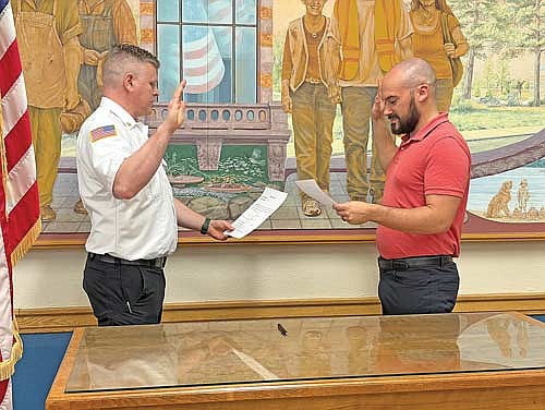 Rhinelander’s new fire chief, Adam “A.J.” Johnson, was officially sworn in Wednesday, April 29 by Rhinelander city clerk Austyn Zarda during a brief ceremony in the city council meeting room at Rhinelander city hall. (Photo by Brian Jopek/Lakeland Times)