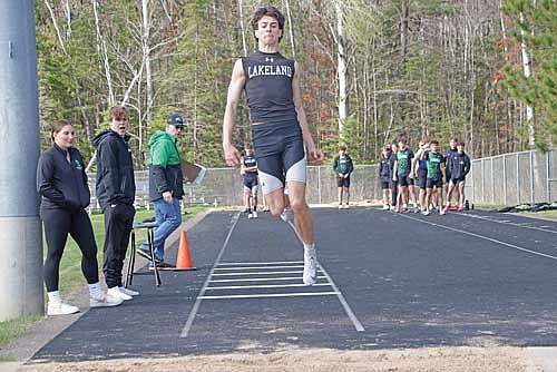 Owen Johnson takes part in the triple jump during the inaugural Oneida County Triangular Tuesday, April 28 at Mike Webster Stadium in Rhinelander. Johnson won the triple jump, 110 hurdles and 300 hurdles. (Photo by Jeremy Mayo/River News)