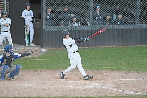 Jeffrey Bolton hits a single in the seventh inning of a conference game against Merrill Friday, May 1 at the Lakeland Union High School baseball field in Minocqua. (Photo by Brett LaBore/Lakeland Times)