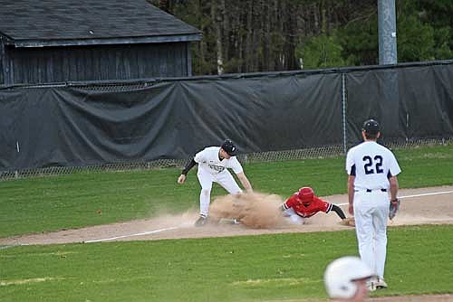 Justin Doud-Sero tags out Medford’s AJ Guden in the first inning of a conference game Monday, May 4 at the Lakeland Union High School baseball field in Minocqua. (Photo by Brett LaBore/Lakeland Times)