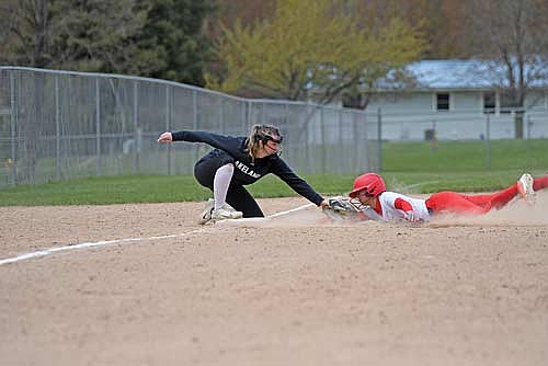 Addison Trapp tags out Waupaca’s Savannah Floistad in the second inning of a non-conference game Saturday, May 9 at Don Martzke Sports Park in Shawano. (Photo by Brett LaBore/Lakeland Times)