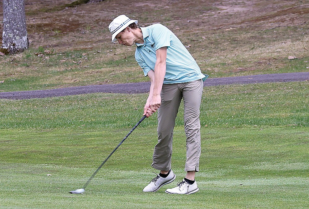 Rhinelander’s Chase West hits his second shot on the par-5 12th hole during the fourth leg of the GNC golf tournament Friday, May 8 at Eagle River Golf Course. West shot 77 on Friday to finish third in the individual standings. (Bob Mainhardt for the River News)