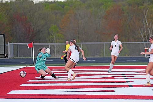Karsyn Dyre scores a goal past Wausau East goalie Claira Neitzel in the second half of a non-conference game Friday, May 15 at Wausau East High School. Dyre’s goal put the Thunderbirds up 1-0 at the 79 minute, 49 second mark with the assist to Lexi Gindorff, far right. (Photo by Brett LaBore/Lakeland Times)