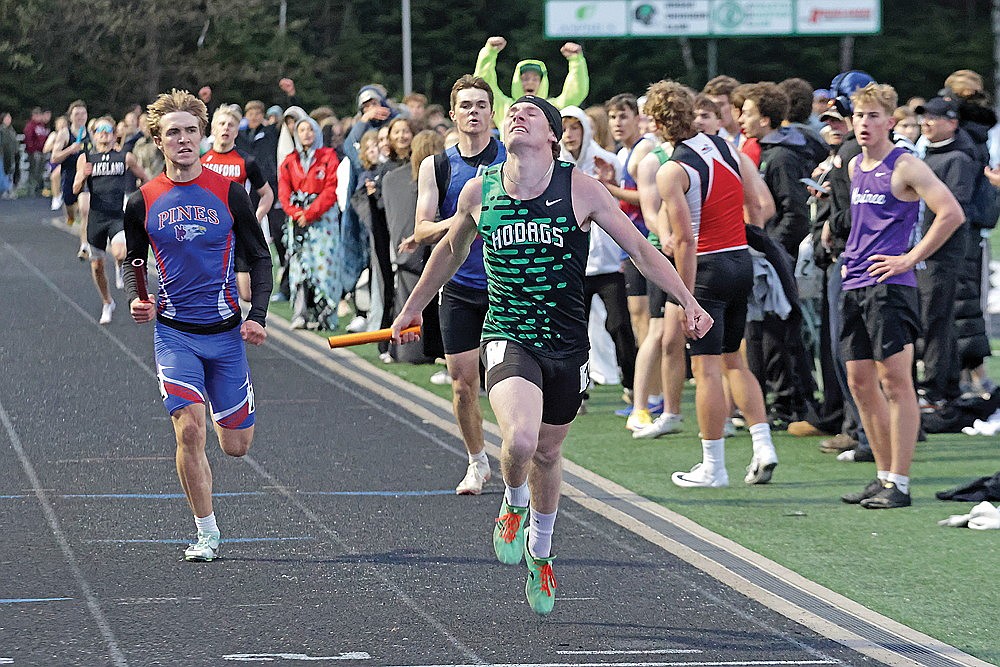 Rhinelander’s Cyrus Leisure beats Northland Pines’ Ryan Rydeski to the finish line to win the 4x400-meter relay at the GNC championship track meet at Mike Webster Stadium Tuesday, May 19. The Hodags won eight events to defend their conference title, beating Lakeland by 15 points. (Jeremy Mayo/River News)
