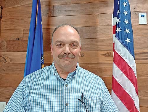Mark Fetzer received his latest annual appointment as Newbold’s fire chief at the Newbold town board meeting May 14. (Photo by Ardith Carlton/River News)