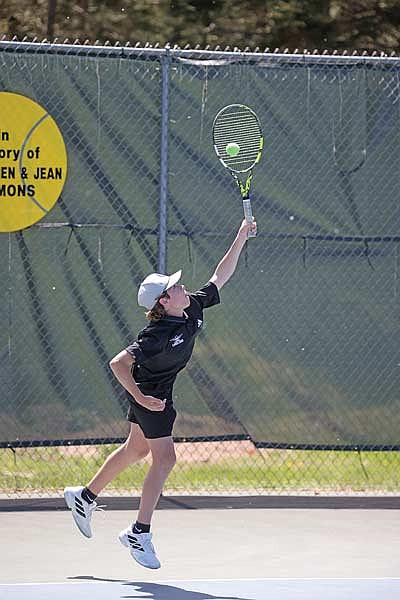 Main Byram makes a serve in a No. 1 doubles match during the Great Northern Conference meet Thursday, May 21 at the Rhinelander High School tennis courts. (Photo by Blake Richard/River News)