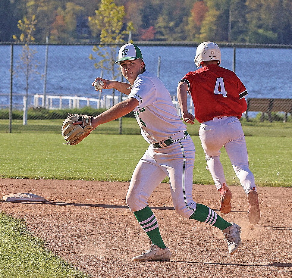 Rhinelander’s Josh Willoughby makes a throw to first base during the third inning of a GNC baseball game against Medford at Stafford Field Thursday, May 21. The Hodags fell to the Raiders, 2-1, in the conference finale. (Bob Mainhardt for the River News)