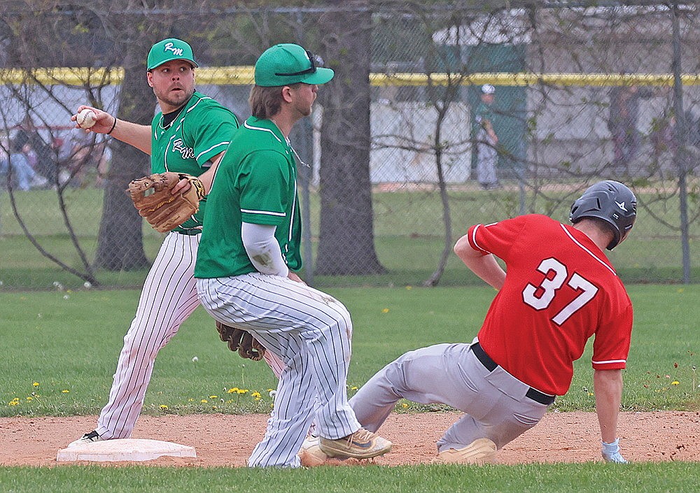 Rhinelander’s Trevor Young looks to make a throw to first in front of teammate Easton Senoraske after retiring Wisconsin Rapids’ Alex Osness during a Dairyland League baseball doubleheader at Stafford Field Saturday, May 23. (Bob Mainhardt for the River News)