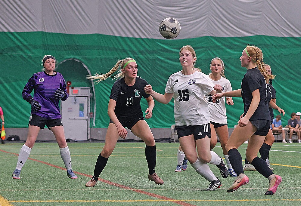 Rhinelander’s Kiley Pooch (11) and Jordan Manske (5) attempt to score against Mosinee’s Danica Henning during a conference game in the Hodag Dome on May 26. The Hodags outshot Mosinee 22-0 on the way to a 4-0 victory. (Bob Mainhardt for the River News)