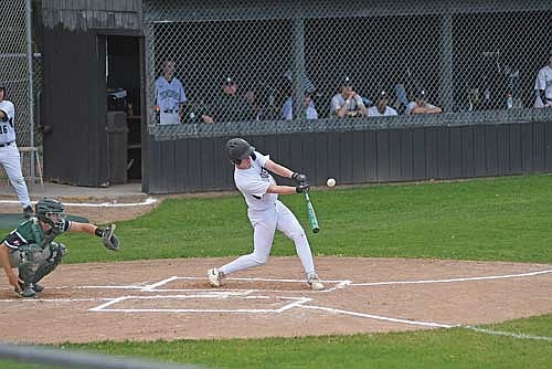 Gabe Karch hits a double in the first inning of an 8-6 win over Chequamegon Tuesday, May 26 at the Lakeland Union High School baseball field in Minocqua. (Photo by Brett LaBore/Lakeland Times)
