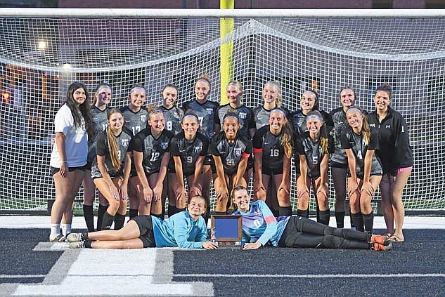 The Lakeland girls’ soccer team poses with the Great Northern Conference trophy following a 2-0 win over Medford Tuesday, May 26 at IncredibleBank Field in Minocqua. Team pictured, back row from left, are manager Sabrina Poisson, Laine Jelinski, Annelise Mayer, Kenzie Blohm, Lexi Gindorff, Maddie Hohlweck, Kasey Wise, Addie Hagen, Karsyn Dyre, manager Jadyn Wentland; middle row, Nora Metzger, Jaime Jorgensen, Bella Peterson, Tayiah Bauman, Molly Jorgensen, Malin Awker, Katy Janowiec; front row, Emma Bergquist and Ava Evenhouse. (Photo by Brett LaBore/Lakeland Times)
