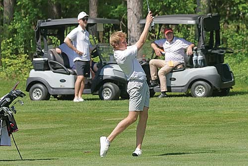 Davis Kock hits his second shot on the fifth hole during a WIAA Division 1 regional meet Tuesday, May 26 at Greenwood Hills Country Club in Wausau. Kock advanced to the sectional meet individually after shooting a 79. (Photo by Jeremy Mayo/River News)