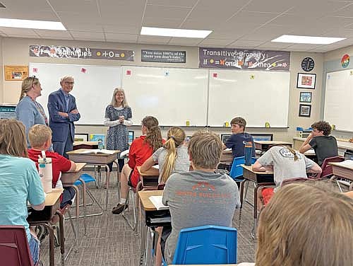 Gov. Tony Evers, middle, is welcomed by teachers Cindy Burnett, left, and Terry Theisen, right, while visiting North Lakeland School seventh-graders during a visit to the school on Thursday, May 28, in Manitowish Waters.
(Photo by Trevor Greene/Lakeland Times)