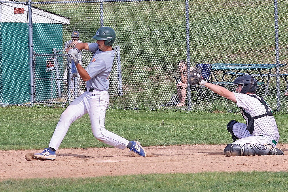Minocqua’s Ben Peterson swings at a pitch during the eighth inning of the second game of a Dairyland League baseball doubleheader against Rhinelander at Stafford Field Sunday, May 31. Initially called a game-ending swinging third strike on the field, the umpires over turned the call and Minocqua eventually defeated Rhinelander in nine innings, 3-2. (Bob Mainhardt for the River News)