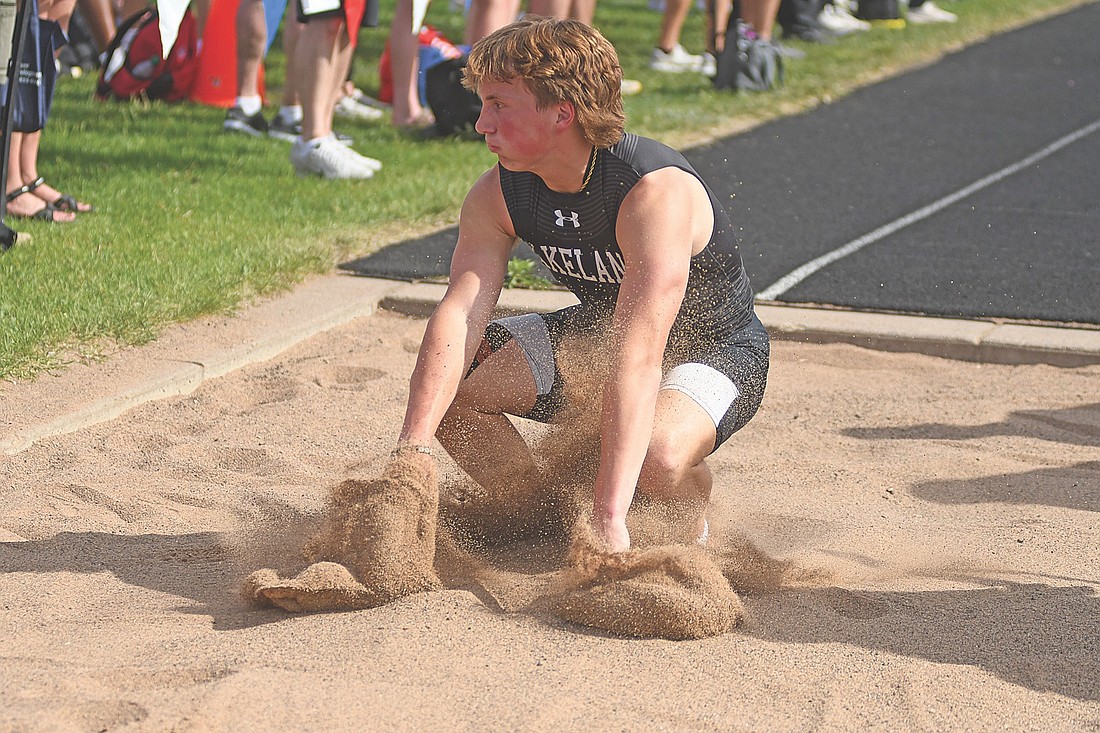 Marshall Holmquist lands in the triple jump pit during a WIAA Division 2 sectional meet Friday, May 29 at Dairy State Bank Stadium in Rice Lake. Holmquist has the 11th-best mark in the state field. (Photo by Brett LaBore/Lakeland Times)