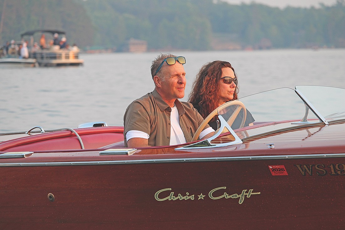 Tom and Mindy Clark cruise in their 1949 Chris Craft Deluxe Runabout during the antique and classic boat parade at halftime of the Min-Aqua Bats Water Ski Show on Friday, June 16, 2024, in Minocqua. (Photo by Trevor Greene/Lakeland Times)