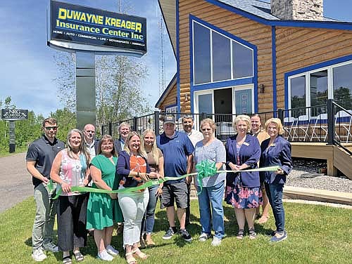 The new location of DuWayne Kreager Insurance Center was recently celebrated with a ribbon cutting by the Rhinelander Area Chamber of Commerce Ambassadors. From L-R: Luke Durkee, Kathy Stinson, Tony Mustacci, Amy Johnson, Rod Ankrom, Dawn Kreager, Alishya Kreager, Wayde Kreager, David Schmitz, Joyce Kreager, Tarsie Goes, Lauren Sackett and Diane Sowinski. (Contributed photograph)