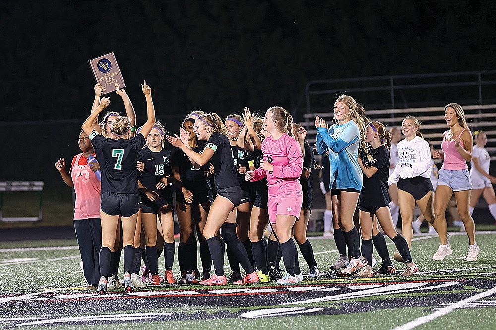 The Rhinelander High School girls’ soccer team celebrates winning the regional championship after defeating Ashland 4-3 in penalty kicks at Mike Webster Stadium in Rhinelander Saturday, June 6. (Bob Mainhardt for the River News)