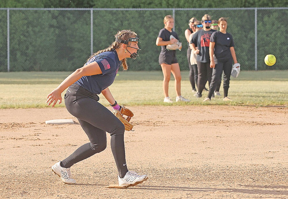 Ava Rathbun fields a grand ball during Rhinelander Lady Rebel American Legion softball team practice Wednesday, June 3 at the Haug Family Softball Complex. Rathbun, a senior-to-be, is one of several Rhinelander High School varsity softball players competing for the Lady Rebels this summer. (Bob Mainhardt for the River News)