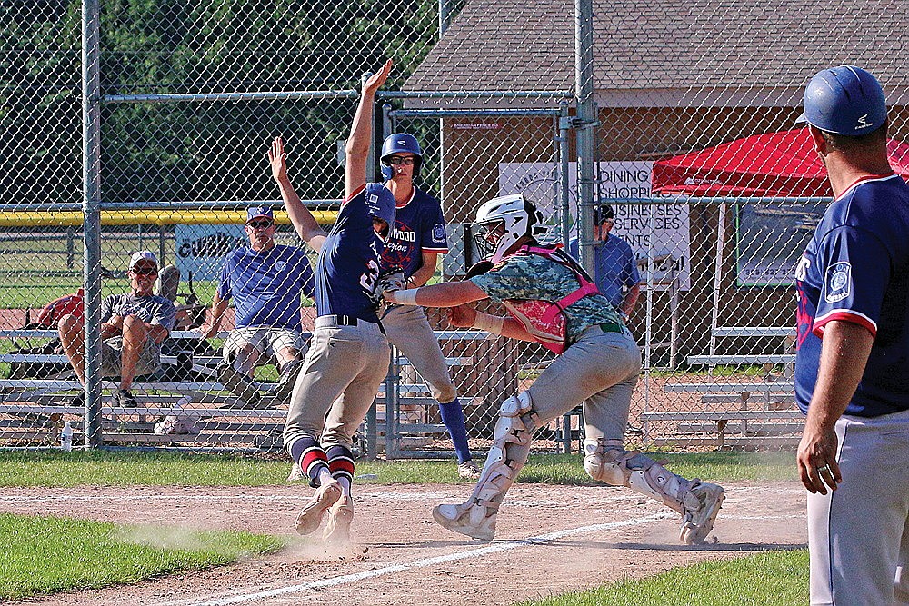 In this July 26, 2025 file photo, Rhinelander’s Jackson Waydick tags out Northwoods’ Griffin Beyer in a play at home plate during the third inning of a Wisconsin AA American Legion regional tournament game in Minocqua. The Rebels kicked off the 2026 legion schedule last night at Medford and will face Northwoods tonight at Stafford Field. (Bob Mainhardt for the River News)