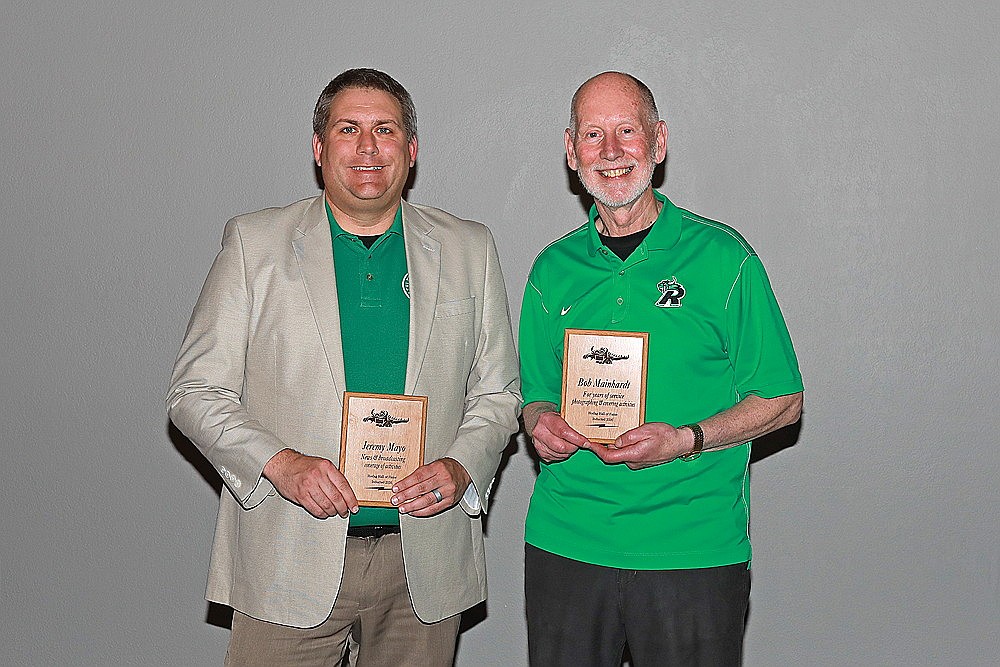 River News sports editor Jeremy Mayo, left, and photographer Bob Mainhardt, right, were inducted into the Rhinelander Athletic Booster Club’s Hodag Hall of Fame during a banquet at the Pines Event Center in Rhinelander May 20, 2026. The two have, combined, more than 50 years of experience covering Rhinelander High School sports. (Contributed photograph)