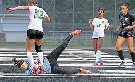 Ava Evenhouse lays out for the ball as Rhinelander’s Vivian Lamers looks to get a foot on it in the second half of a WIAA Division 3 sectional semifinal game Thursday, June 11 at IncredibleBank Field in Minocqua. (Photo by Blake Richard/River News)