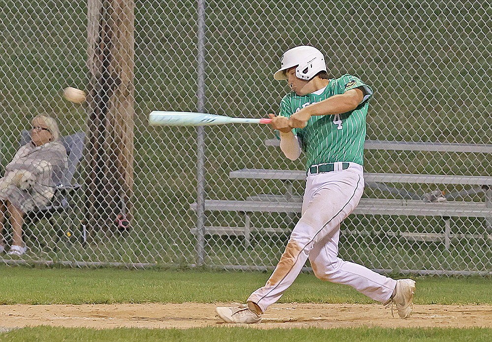 Rhinelander’s Josh Willoughby hits an RBI single during the sixth inning of an American Legion baseball game against Antigo at Stafford Field Monday, June 15. The Rebels pounded out 18 hits — including three from Willoughby — in a 15-7 victory. (Bob Mainhardt for the River News)
