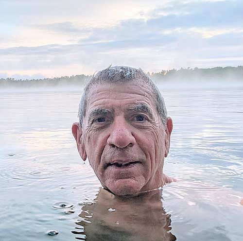 Len Larsen, a longtime resident of St. Germain, enjoys swimming in Moon Lake on April 27, 2026, with a water temperature of 44 degrees.  His presentation will cover fascinating information about proactive approaches for the long-term sustainability of our lakes and rivers. (Contributed photograph)