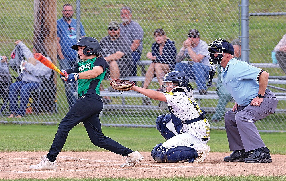 Blake Sundby hits an RBI single during the first inning of a Babe Ruth baseball game against Tomahawk at Stafford Field Tuesday, June 23. (Bob Mainhardt for the River News)